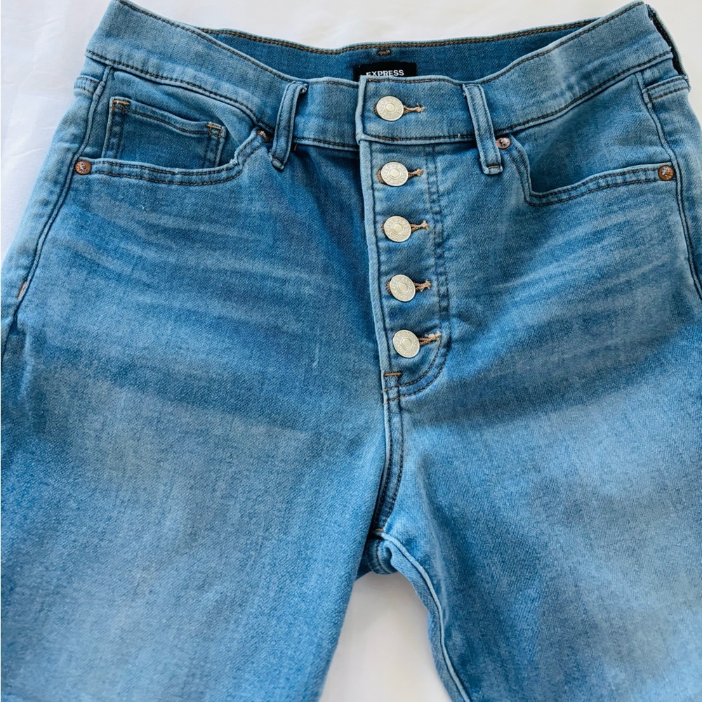 Express Women's Blue Jeans. Stylish and comfortable with button up and straight.